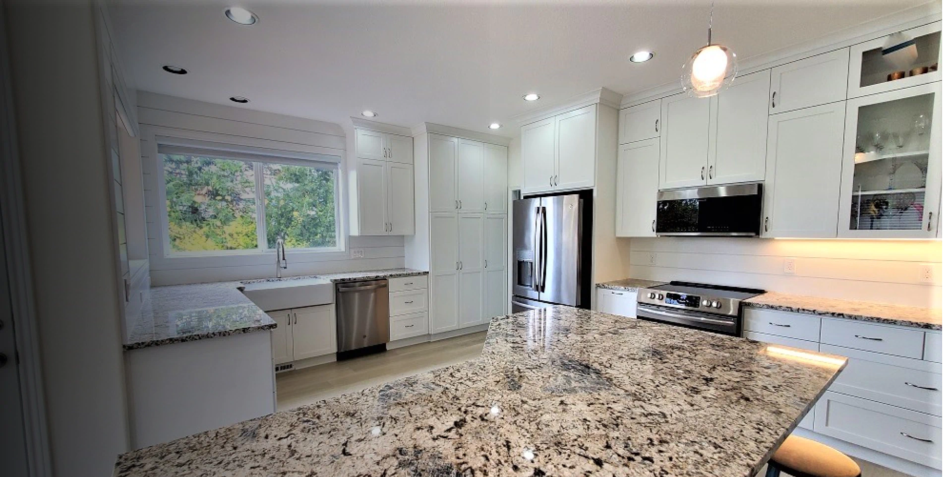 newly remodeled kitchen with marble countertop